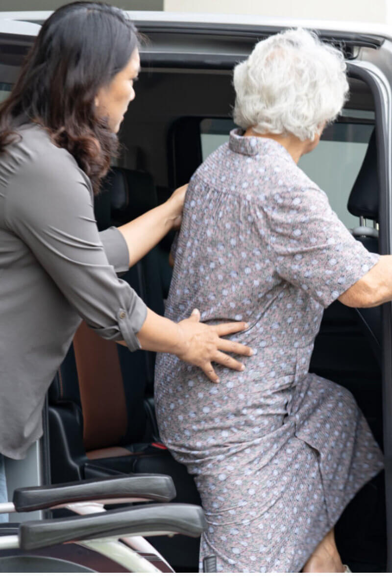 care taker happily teaching elder